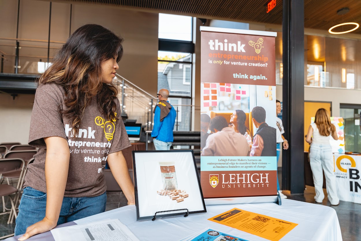 Explore entrepreneurship materials on a display table