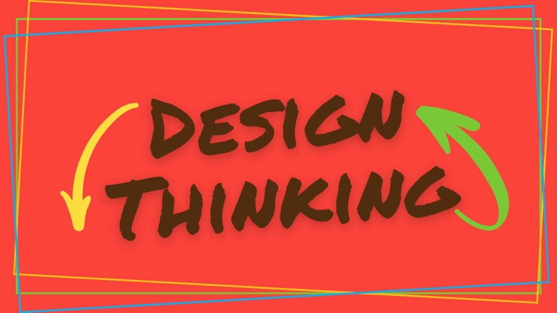the words "Design Thinking" written in sharpie on a red background