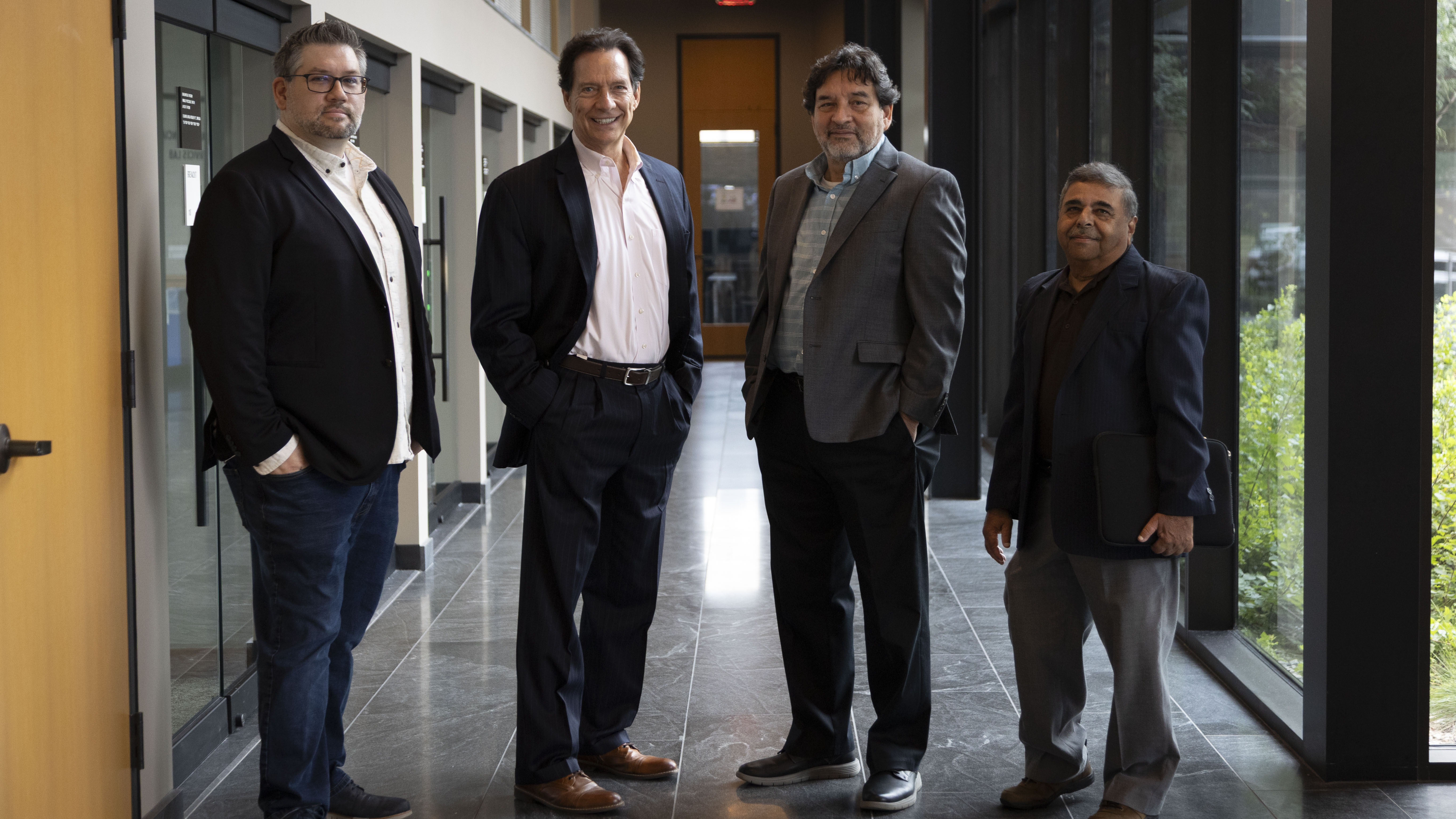 Mike Rinkunas, Rick Smith, Dr. Sudhakar Neti and Dr. Carlos Romero (l to r) celebrate the signing of an Express Startup License.
