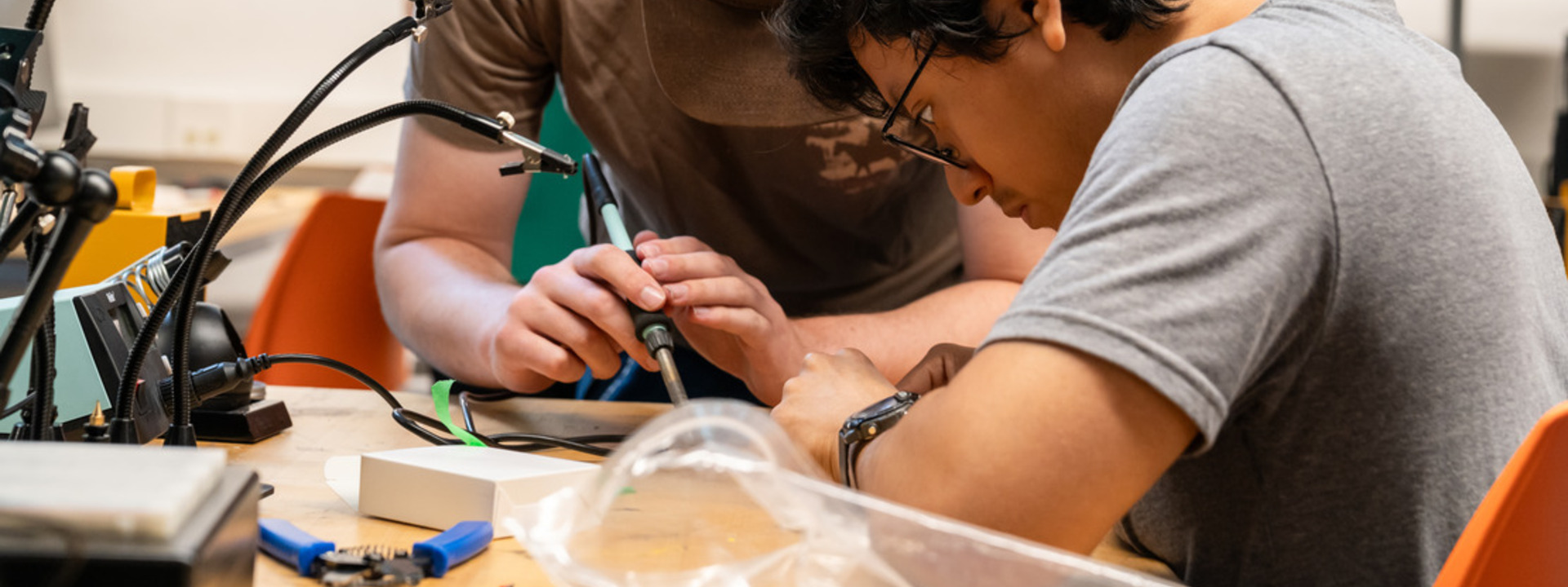 two Lehigh students put their heads together to develop a product prototype.