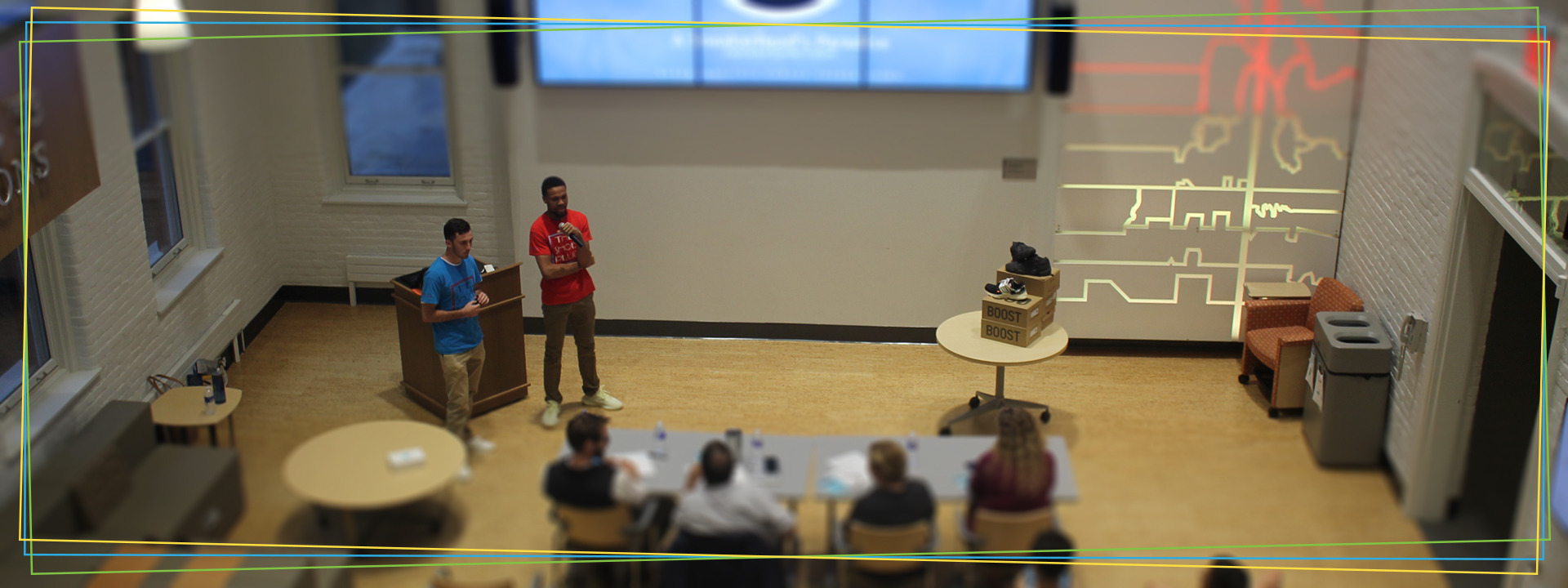students pitch their venture project to guest investors