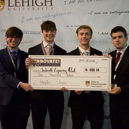 People's Choice Winner 2026 hold a giant check